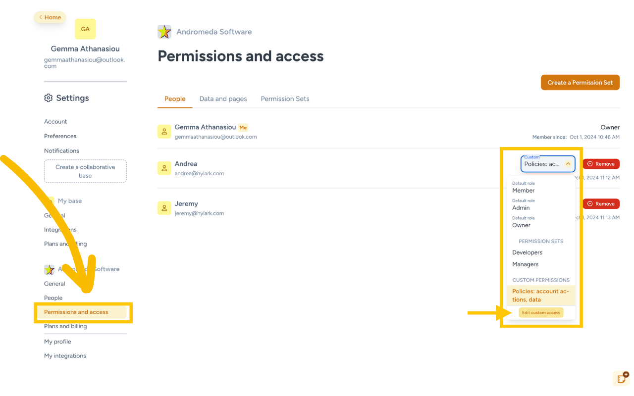 Screenshot of the 'Permissions and Access' settings page on the Hylark platform under 'Andromeda Software,' showing a list of members with their assigned roles. The left sidebar highlights the 'Permissions and Access' section, emphasized by a large yellow arrow. A dropdown menu on the right is outlined, displaying options for default roles ('Member,' 'Admin,' 'Owner') and custom permission sets ('Developers,' 'Managers'). The menu also shows a 'Custom Permissions' option with a button labeled 'Edit custom access,' allowing users to customize access levels for individual members.